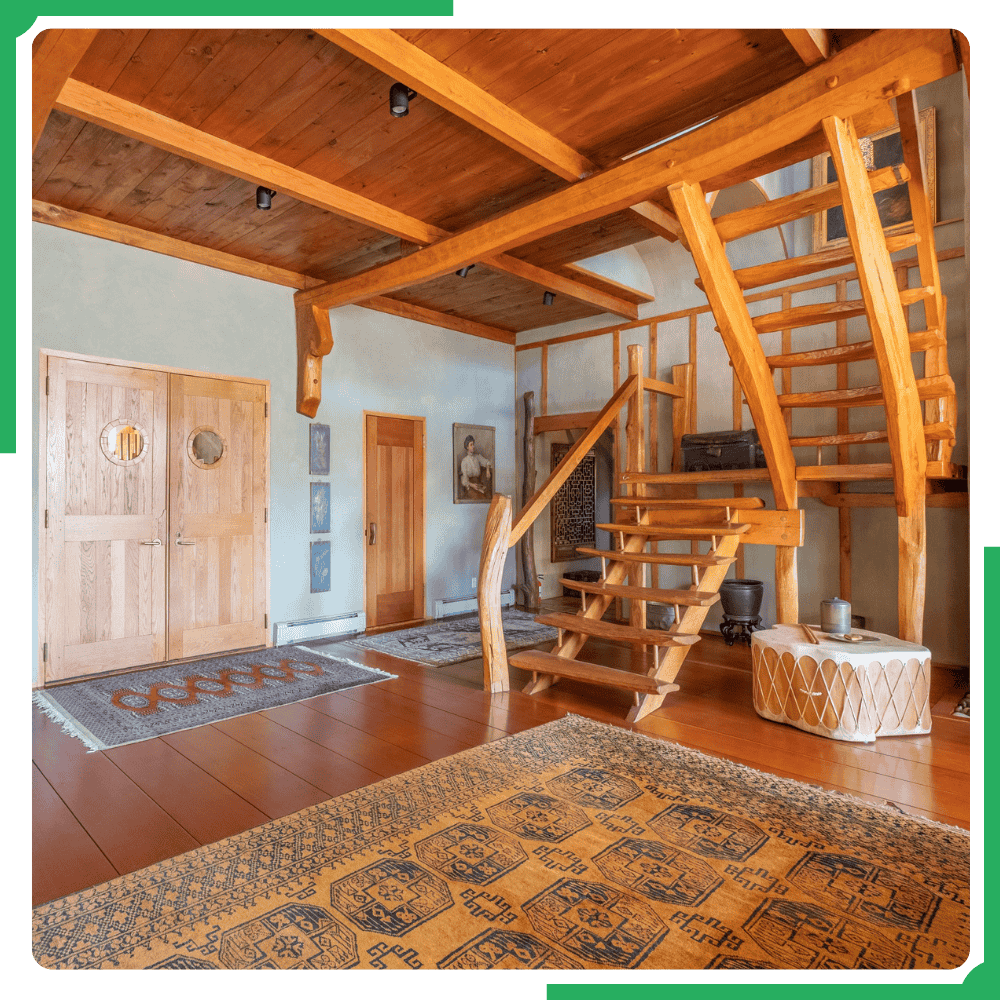 A bright, spotless cabin living room in Gatlinburg after a professional deep clean, with sunlight streaming through the windows onto polished wood and neatly arranged furniture.